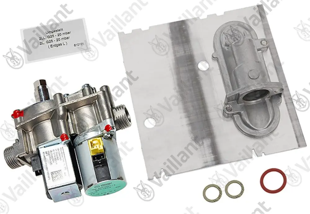 Vaillant Umstellsatz mit zwei Ventilen, einem Gehäuse und Dichtungen, auf silbernem Untergrund. Komponenten zum Umbau von Heizgeräten.
